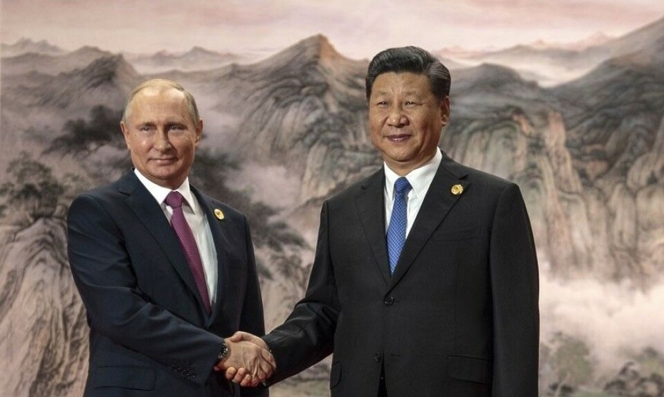 Shaking hands for stronger Russian-Chinese cooperation. Photo: Kremlin.ru