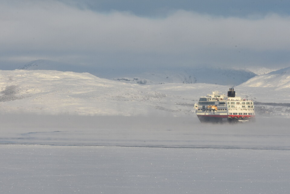 A cruise vessel steaming out the frozen fjord from Kirkenes in the Norwegian-Russian borderland. Photo: Thomas Nilsen