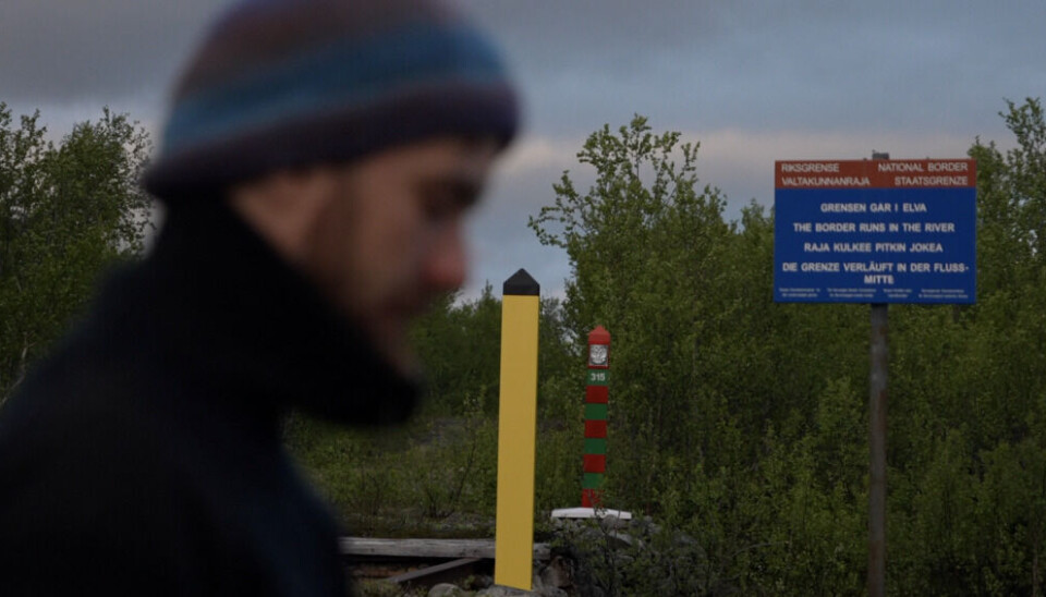 David Kniha from the NIBIO gathered water samples in the river Grense Jakobselv. Norwegian and Russian border polls stand just a few meters from each other on opposite river shores. Photo: Elizaveta Vereykina