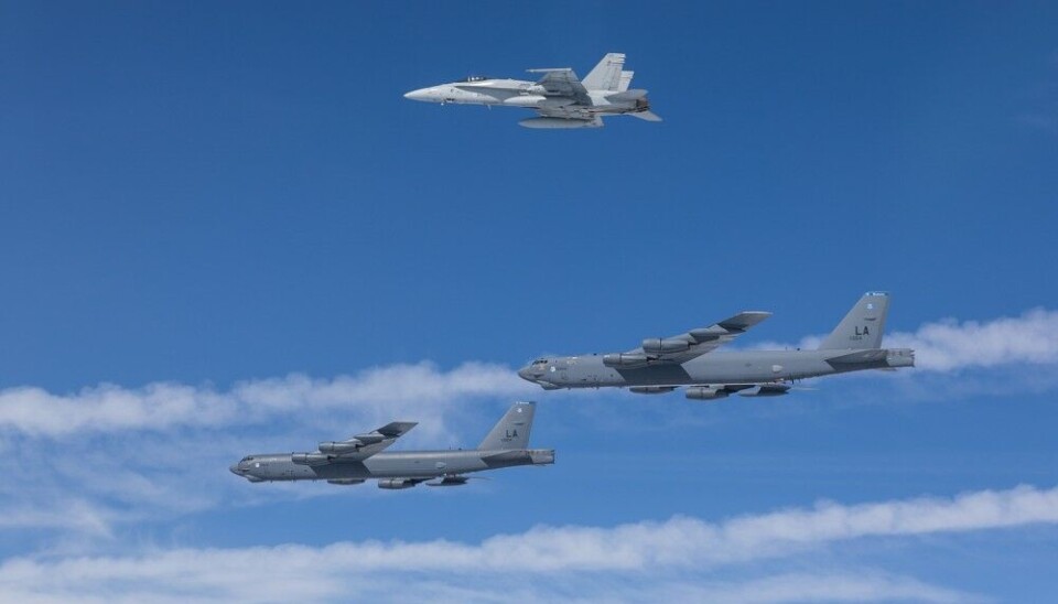 Two U.S. B-52 bombers escorted by a Finnish F/A-18 fighter jet. Photo: Finnish Air Force