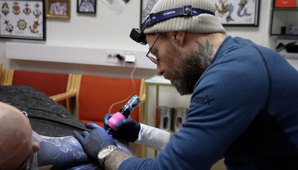 Tattoo artist Tailor Meads in his tattoo-shop in Kirkenes, Arctic Norway.