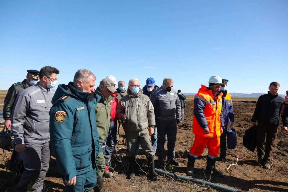 Krasnoyarsk Governor Aleksandr Uss (center) arrives on site five days after the spill. Photo: krskstate.ru