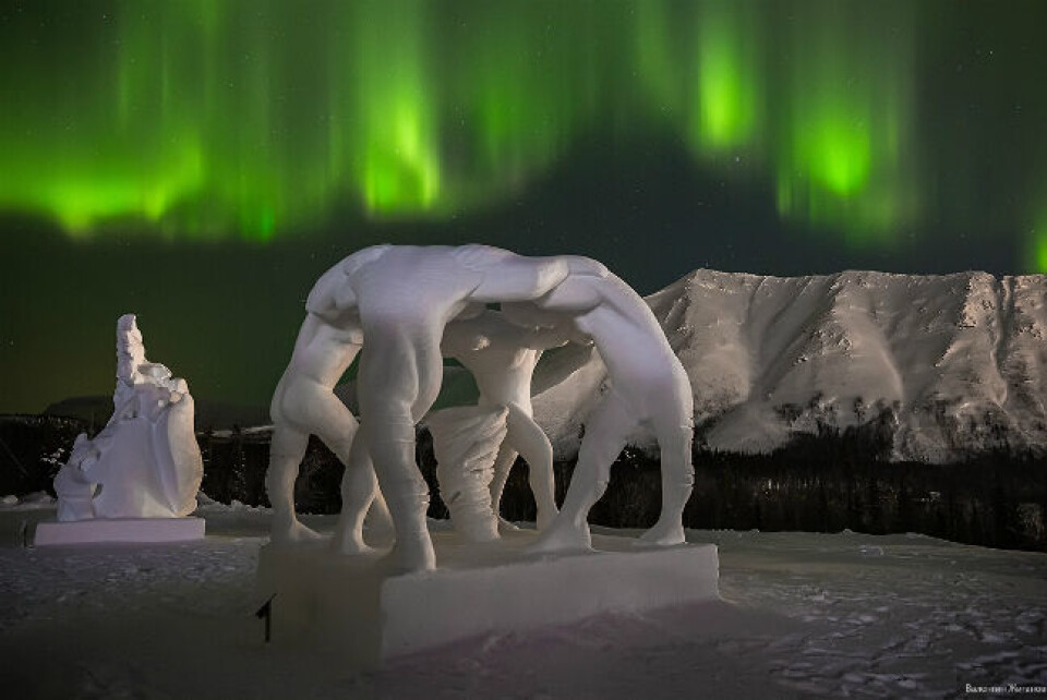 Spectacular snow sculptures under the Northern Lights with the Khibiny Mountains in the background. Photo: Kirovsk Snow Village