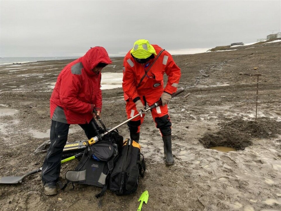 Scientists taking soil samples at a Soviet outpost at Franz Josef Land. Photo courtesy of Russia Arctic National Park