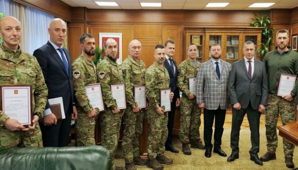 Deputy PM Yuri Trutnev, Minister of Far East and Arctic Aleksei Chekunkov together with ministry officials returning from war. Photo: Far East Russian Federal District on Telegram