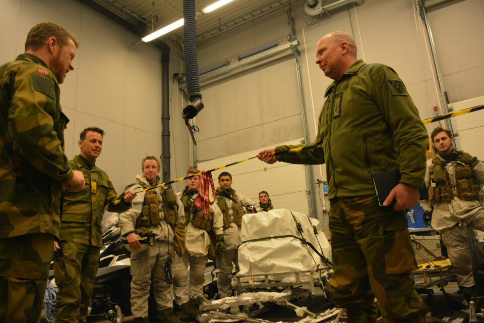 Colonel Lieutenant Jørn Qveller (left), Brigadier Morten Eggen and Colonel Ole Andreas Søbstad officially launches new snowmobiles. Photo: Atle Staalesen