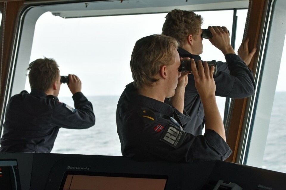 Crew members on “KV Sortland” on watch for ‘persons’ missing at sea. Photo: Thomas Nilsen