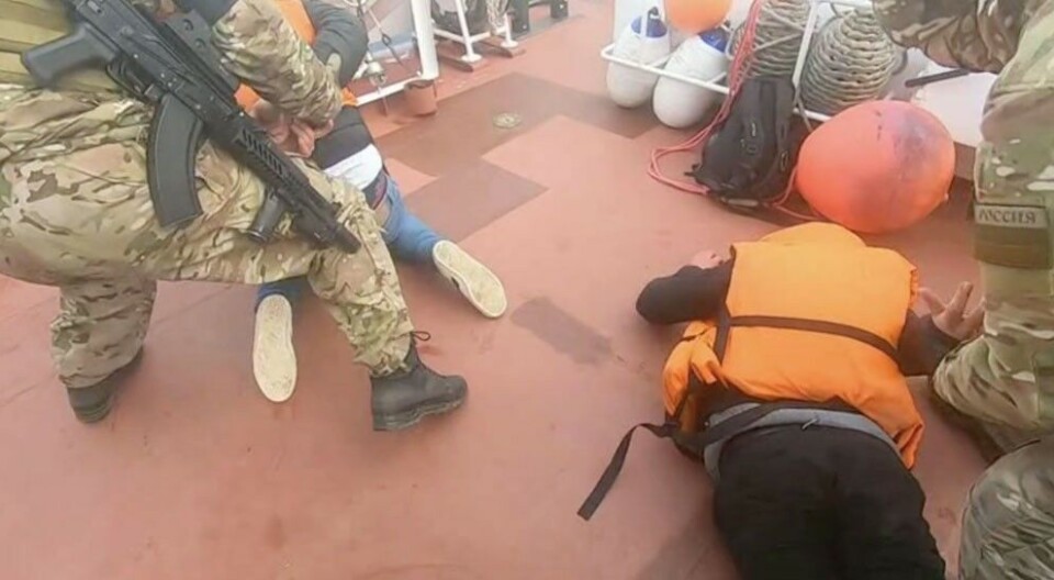 The three Syrians were taken over the FSB's Coast Guard vessel and handcuffed. Photo: Screenshot from the FSB video