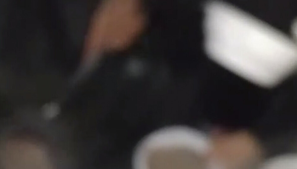Warm porridge to cold migrants. Screenshot from Telegram video