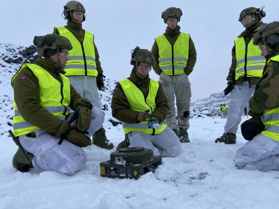 CLICK FOR MORE PHOTOS. The soldiers with the engineering squad make ready one of the anti-tank mines. Photo: Thomas Nilsen
