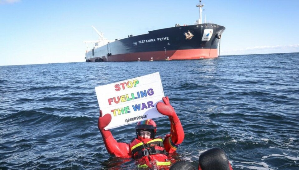 Last year, Greenpeace activists blocked a transshipment of 100,000 tonnes of Russian oil between two supertankers at sea in Danish waters. The activists demanded a ban on fossil fuels from Russia in order to stop fuelling the war economy. Photo: Kristian Buus / Greenpeace