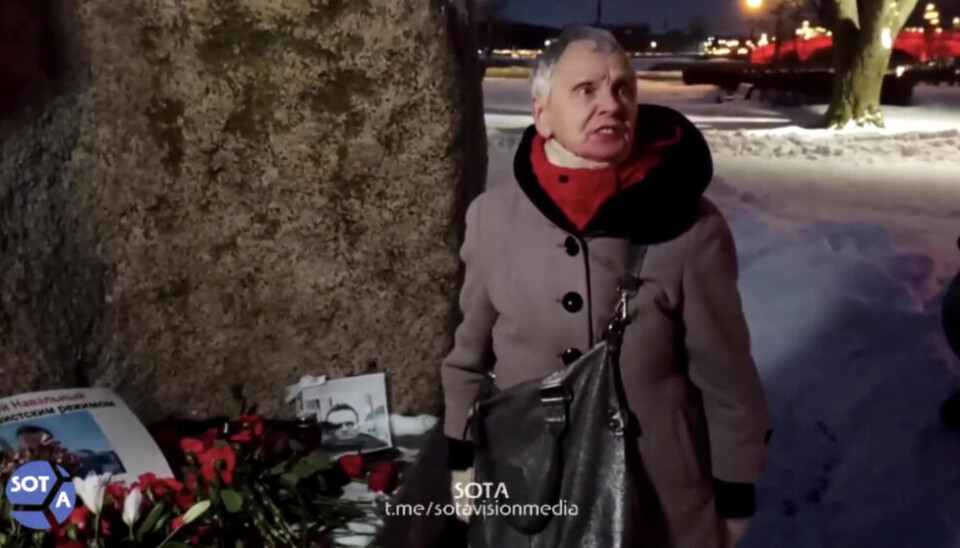 A woman protesting authorities at the Solovetsky Stone in front of FSB headquarters Lubyanka in Moscow Friday evening. Photo via Sota.vision / Telegram