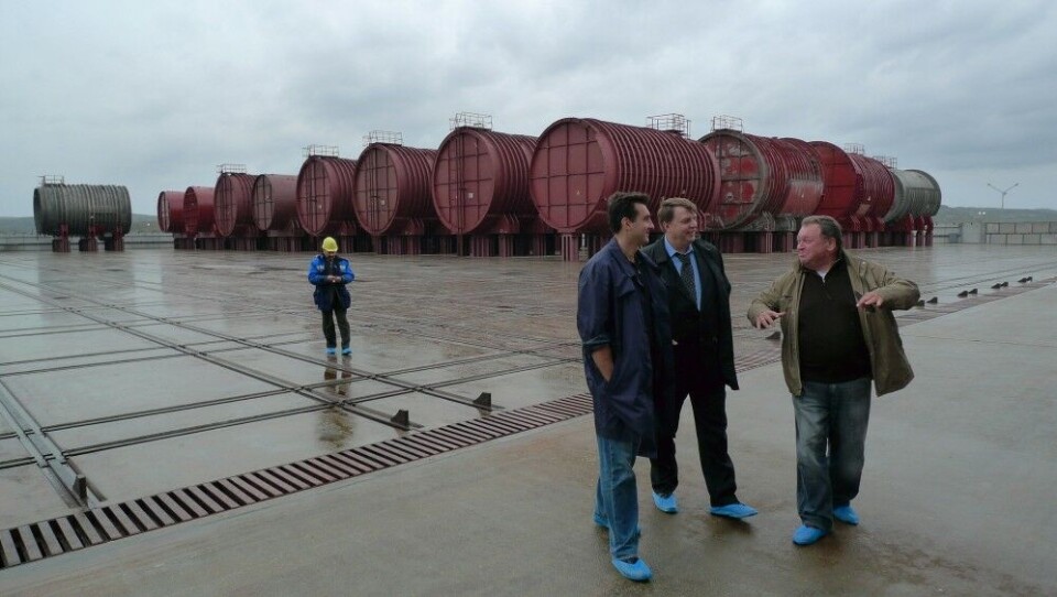 Radioactive contaminated compartments from Cold War submarines are stored side-by-side on the pad. Photo: Thomas Nilsen
