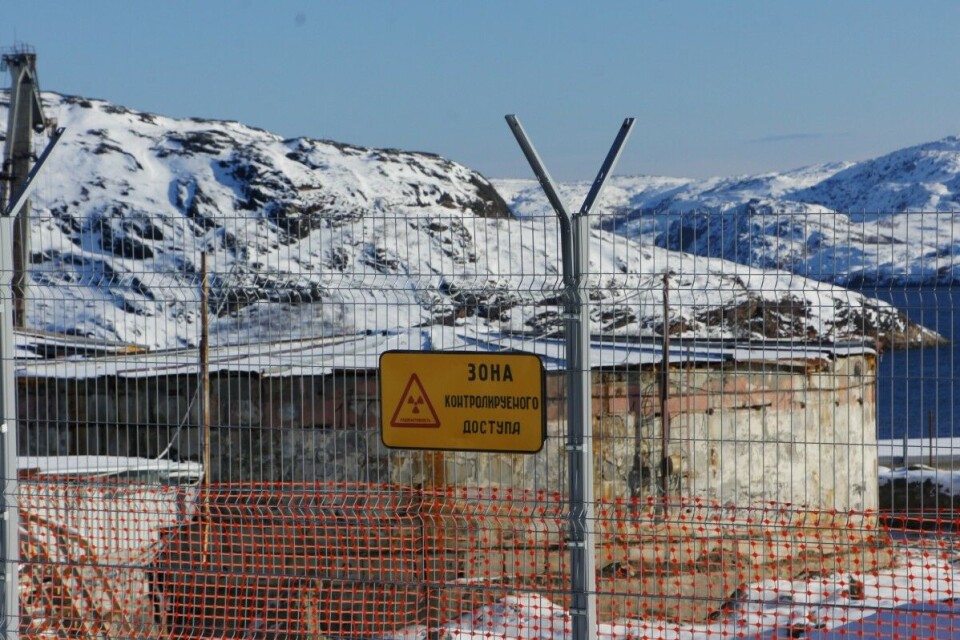 Some 22,000 spent nuclear fuel elements are stored in three old, run-down concrete tanks close to the shore of fjord Litsa fjord. After this photo was taken some years ago, a building is erected over the tanks to secure the clean-up work. Photo: Aleksandr Emelianenko