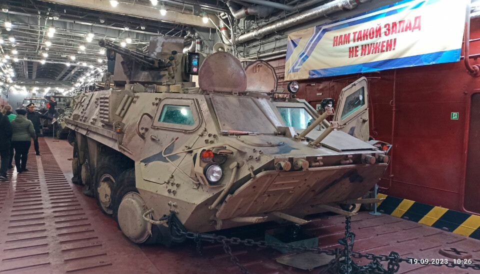 “We do not need this kind of West” a banner reads. It is placed next to a captured Ukrainian BTR-3 armoured personnel carrier. Photo: yunarmy51 on VK