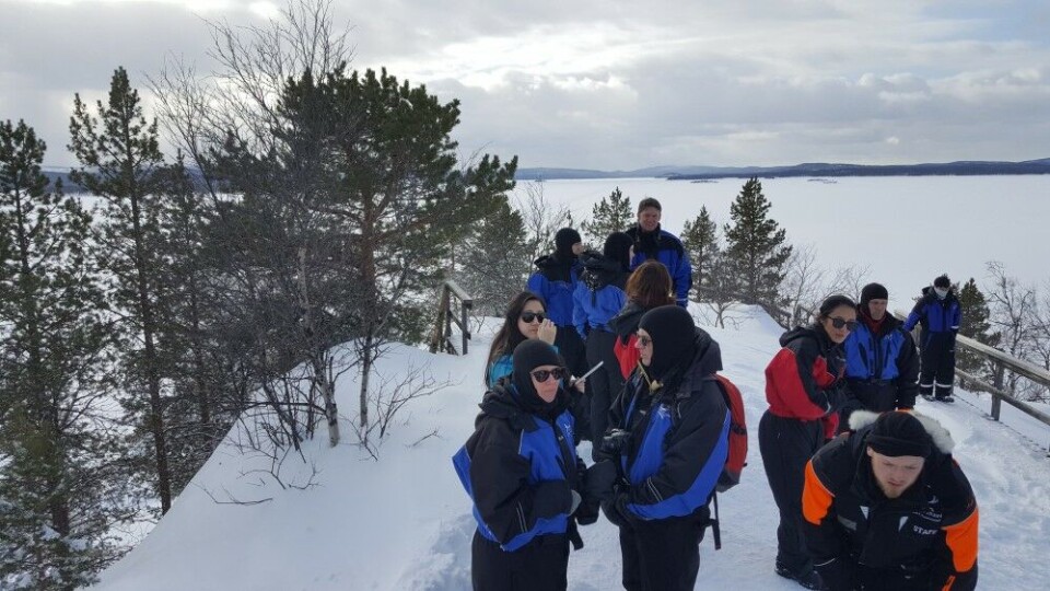 Tourists on the top of Ukonsaari in Lake Inari. Photo: Thomas Nilsen