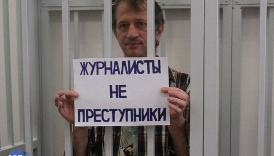 Journalist Roman Ivanov behind bars in court. Photo: SOTAvision
