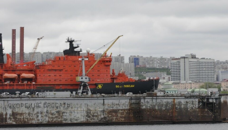 Nuclear-powered icebreaker “50 let Pobedy” is given prolonged lifetime. Here at dock in Murmansk with hotel Azimut and railway station in the background. Photo: Thomas Nilsen