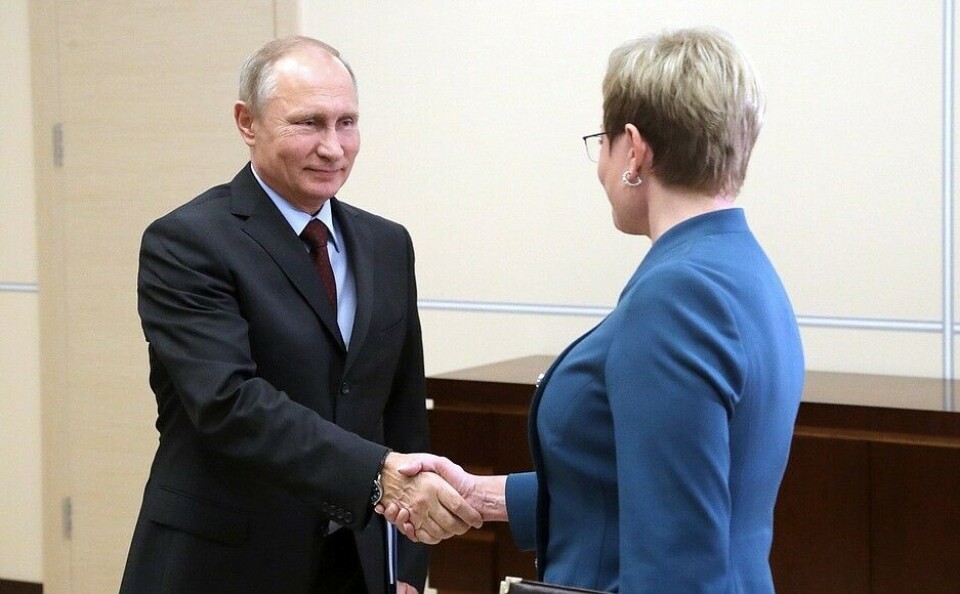 Shaking hands with the president. Photo: Kremlin.ru