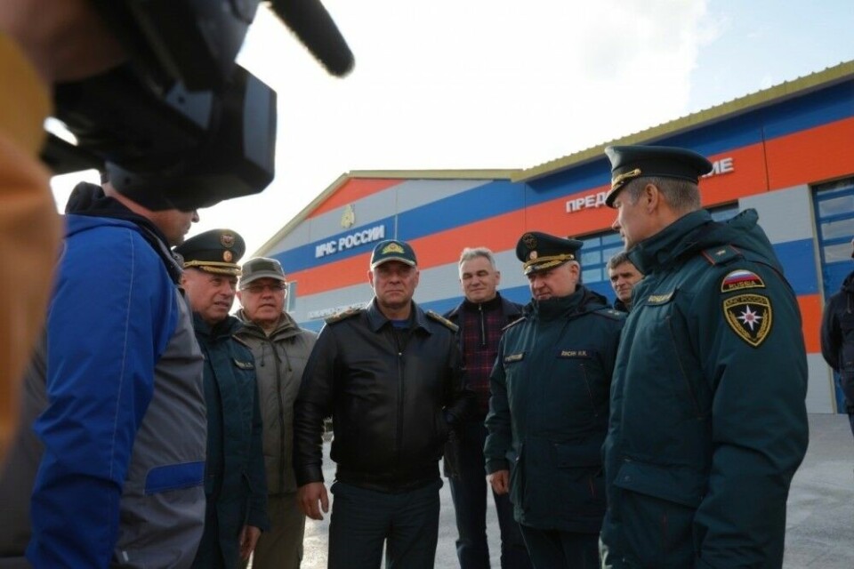 Yevgeny Zinichev (center) died few hours after officially opening a new fire station in Norilsk. Photo: Mchs.gov.ru