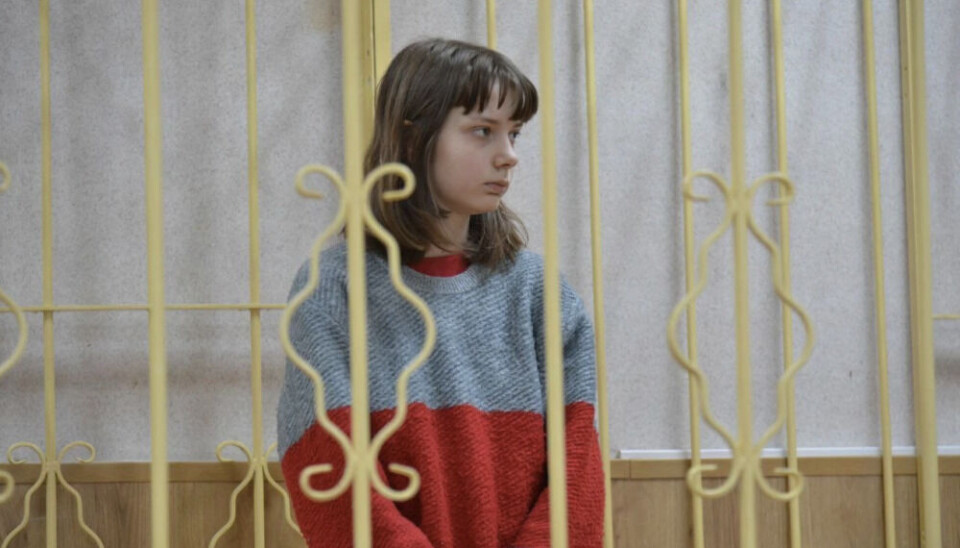 Olesya Krivtsova behind bars in the court room last December. Photo courtesy of 29.ru