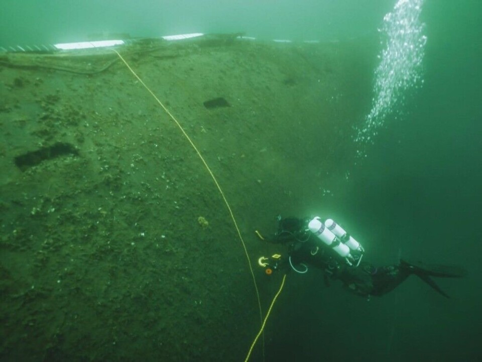 A diver examines the hull of the dumped nuclear powered submarine K-27 in the Kara Sea. Photo: Centre for Underwater Research of the Russian Geographical Society