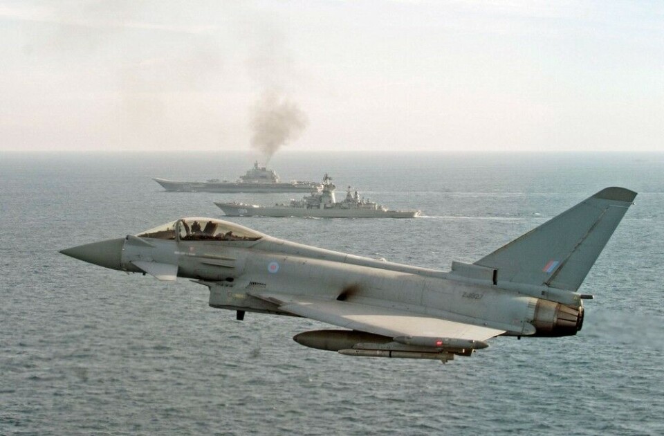 Russian navy's two largest vessels 'Admiral Kuznetsov' and 'Pyotr Veliky' sail into the North Sea followed by a Typhoon from Royal Air Force. Photo: Ministry of Defence, UK