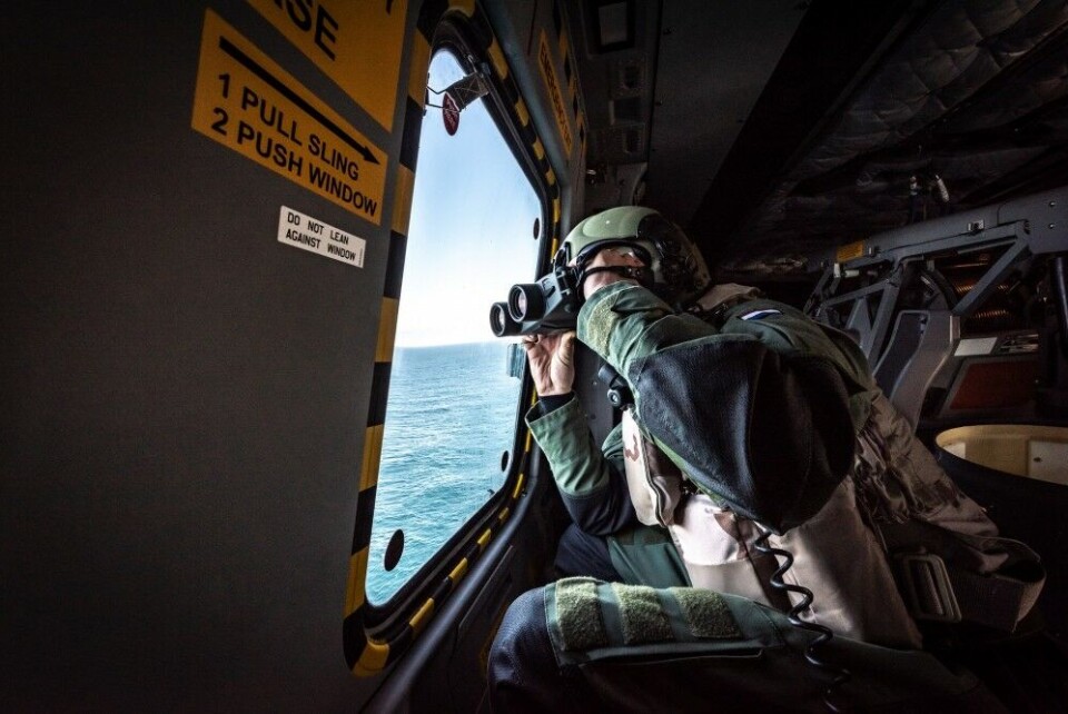 A Dutch Navy Aircrewman maintains look-out over the sea surface while conducting an Anti-Submarine Warfare Mission (CASEX) aboard an NH-90 helicopter, launched by HNLMS Van Speijk during Dynamic Mongoose 18. NATO Photo by FRA N WO Christian Valverde
