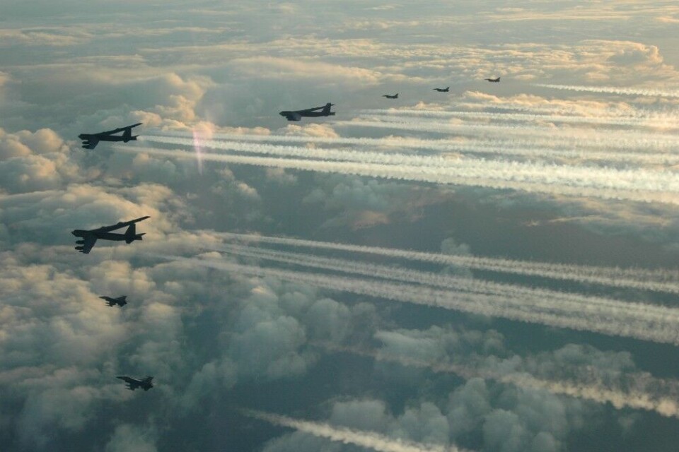 Three B-52 bombers flying with Norwegian F-16s. Photo: Norwegian Air Force