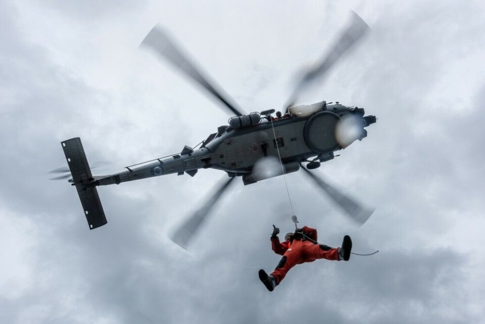 A Danish Navy diver is winched aboard the MH-60 helicopter from HDMS Niels Juel plateform while training, during Exercise Dynamic Mongoose. NATO Photo by FRA N WO Christian Valverde