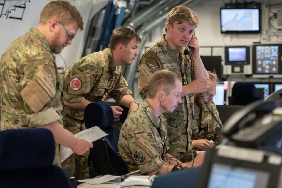 A Danish Tactical Officer and Warfare Supervisors focus on the tactical picture around SNMG1 flagship HDMS Niels Juel, during the first manoeuvre drills of Dynamic Mongoose 18. NATO Photo by FRA N WO Christian Valverde