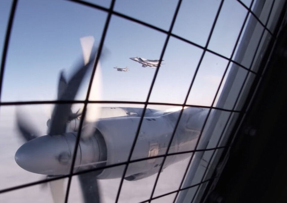 The Russian MiG-31 flies between the anti-sub Tu-142 and the Norwegian F-16. Screenshot