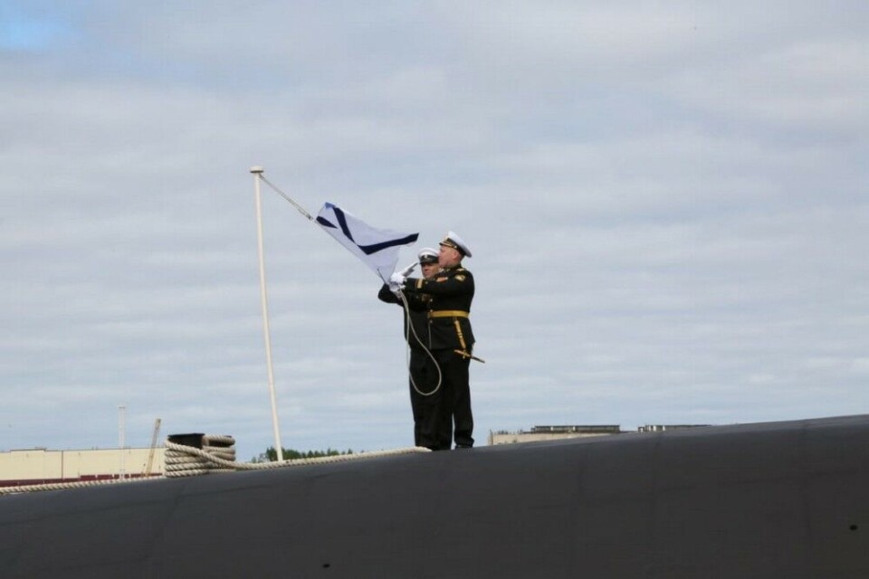 The Navy flag was raised onboard Russia’s first Borei-A class strategic missile submarine. Photo: Russian Defence Ministry
