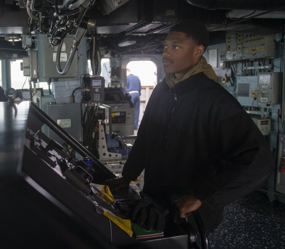 Seaman Christian J. Coleman mans the helm in the pilot house aboard the Arleigh Burke-class guided-missile destroyer USS Roosevelt sailing the Barents Sea. Photo: Austin G. Collins / U.S. Navy