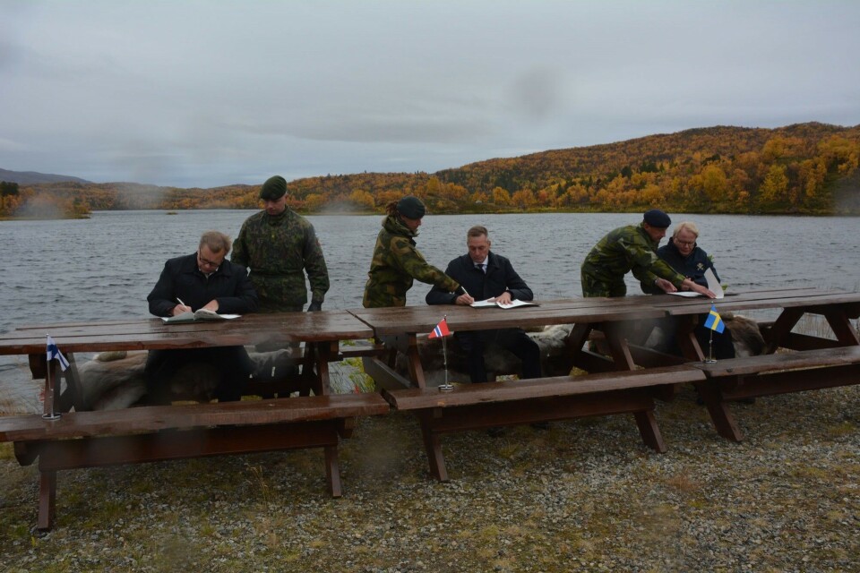 Wind and rain as new trilateral agreement was signed. Photo: Atle Staalesen