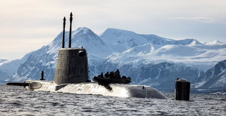 The Royal Navy’s Astute-class is Britain’s newest nuclear-powered attack submarine. Here sailing Lyngen fjord in northern Norway with a group of specially trained soldiers preparing a raid to shore with a zodiac. Photo: UK Ministry of Defense