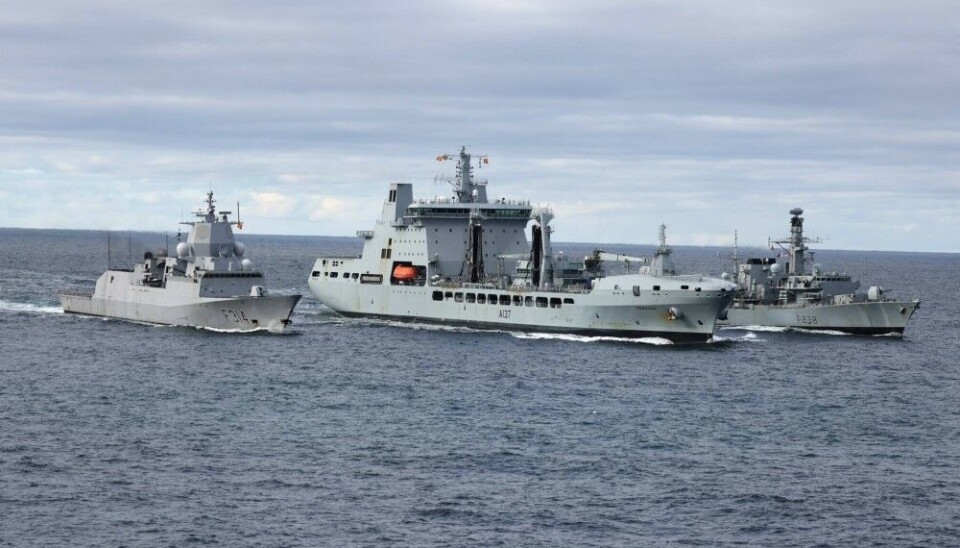 Norwegian navy frigate 'Thor Heyerdahl', 'HMS Northumberland' and 'RFA Tiderace' sailing side-by-side in the Barents Sea.