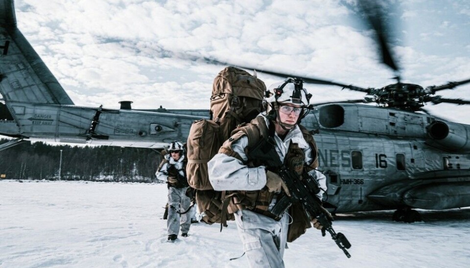 A Norwegian soldier with Armoured Battalion, Brigade Nord, Norwegian Army, runs off a U.S. Marine Corps CH-53E Super Stallion with Marine Heavy Helicopter Squadron 366 (HMH-366), 2nd Marine Aircraft Wing, during Exercise Cold Response 22 in Setermoen, Northern Norway Photo: Sgt. William Chockey, U.S. Marine Corps Forces, Europe