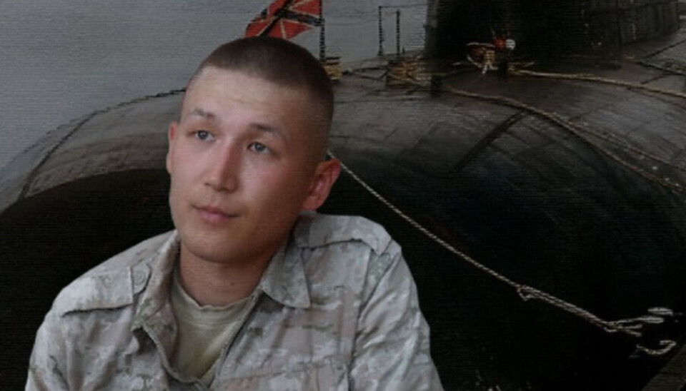 Danis Ishmuratov (25) with a photo of his father's submarine, the Kursk. Screenshot from Kommersant video interview / Telegram