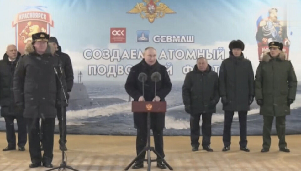 Vladimir Putin praised the shipyard in Severodvinsk for its work on building new modern submarines. To the left, Commander of the Russian navy, Admiral Nikolai Yevmenov. Screenshot from Sevmash film via Vkontakte