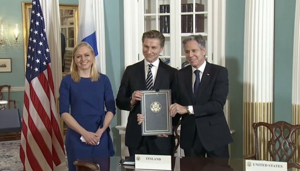 Finland's Minister of Defence Antti Häkkänen and Minister of Foreign Affairs Elina Valtonen together with US State Secretary Antony Blinken. Screenshot of agreement signing ceremony