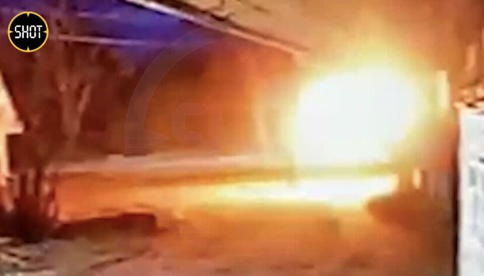 A CCTV captured the moment when a person throw a bottle of burning liquids at the military commissariat building. Photo courtesy of SHOT via Telegram