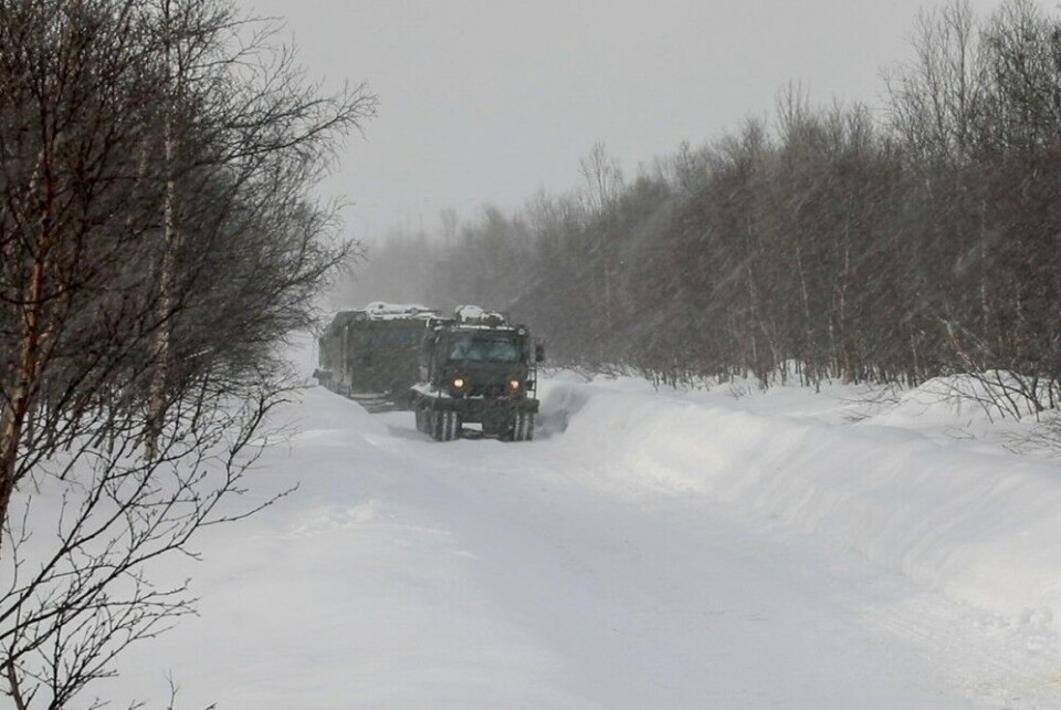 The first of the two military vehicles is marked with a Red Cross, clearly identify Medical personnel in the field. Photo: Northern Fleet press service