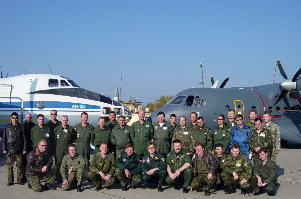 Russian and French crews flying under the Open Skies Treaty, pose on the tarmac next to their aircrafts. Photo courtesy of OSCE