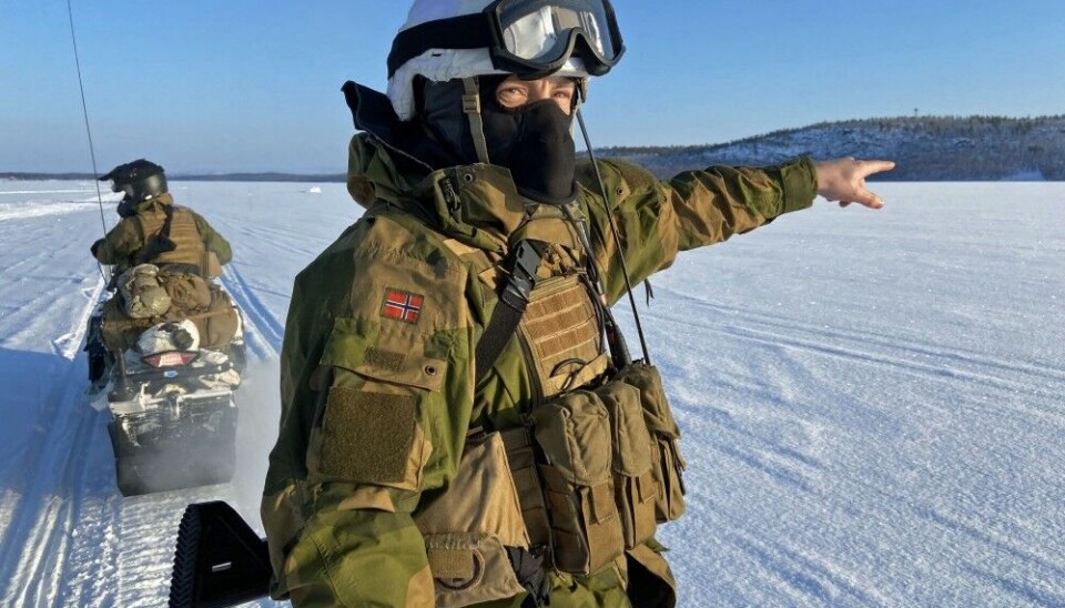 A Norwegian soldier keeps an eye on possible movements on the Russian side of the frozen Pasvik river that forms the border between NATO and Russia. Photo: Thomas Nilsen