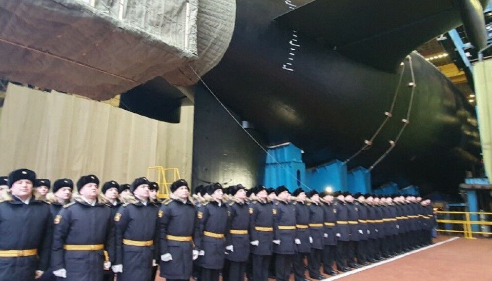 The crew lined up as the submarine was rolled out from the construction hall. The cover hides the pump jet propulsors, making the submarine quieter than vessels with a propeller system. Photo: Russian Defense Ministry