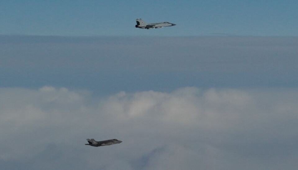 A Norwegian F-35 flying next to a Russian MiG-31 over the skies in international airspace over the Barents Sea on Tuesday. Photo: Norwegian Air Force