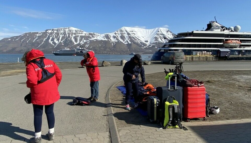 In-flying passengers make ready to embark one of the many expedition cruise ships departing Longyearbyen this season. Photo: Thomas Nilsen