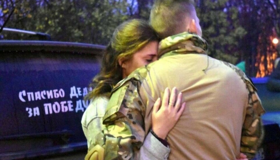 A last hug. Man from the Pechenga rayon, Kola Peninsula, going to war.