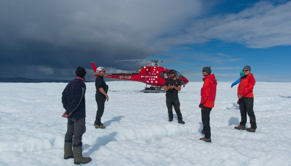 Scientists arrive at the location of their camp on Isunguata Sermia by helicopter. Photo: Henry Patton